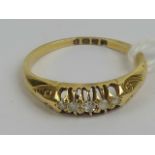 A vintage 18ct gold and five stone diamond ring, hallmarked London, size L, 2.4g.