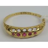 A vintage 18ct gold and five stone ruby ring, hallmarked Chester, size L-M, 1.2g.