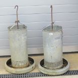 A pair of vintage chicken feeders with hanging hooks, each standing 90cm high.