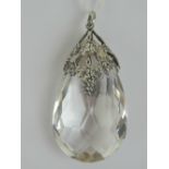 A large teardrop shaped faceted crystal in a pierced grape vine design white metal pendant mount, 5.