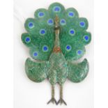 A Sterling silver peacock brooch having green and blue enamelled 'feathers', and hinged tail, 6.
