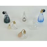 Two Caithness glass perfume bottles together with a Royal Doulton perfume bottle with atomiser and