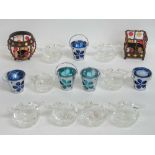 A set of eight crystal glass tealight holders each having two birds to rim, a/f.