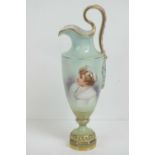 A Continental part gilded ewer in sky ground featuring hand painted bust of child in bonnet upon,