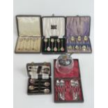 Five sets of silver plated teaspoons in fitted boxes, and a glass and silver plated conserve pot.