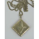 A HM silver locket of square form suspended from one corner, having engraved leaf to front,
