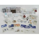 A quantity of assorted dolls house bathroom items including toilet roll holders, towel rails, bath,