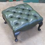 A green leatherette square footstool raised over four cabriole legs, 53cm wide.