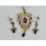 A delightful Edwardian amethyst an seed pearl pendant of floral design having large oval cut