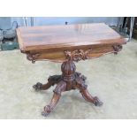 A good 19th century rosewood fold and twist games table, opening to reveal circular baise within,