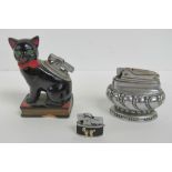 A vintage ceramic cigarette lighter in the form of a cat,