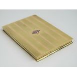 A Cartier 14ct yellow and rose gold cigarette case having geometric enamel initial to front and