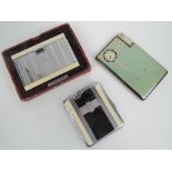 Three vintage Art Deco cigarette cases; a Ronson 'Beauticase' in original box,