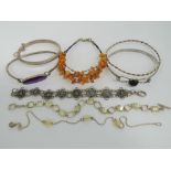 Eight silver bangles and bracelets; one set with turquoise stones, one set with onyx cabachon,
