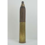 An inert British WWI 18lb hollow charge round,
