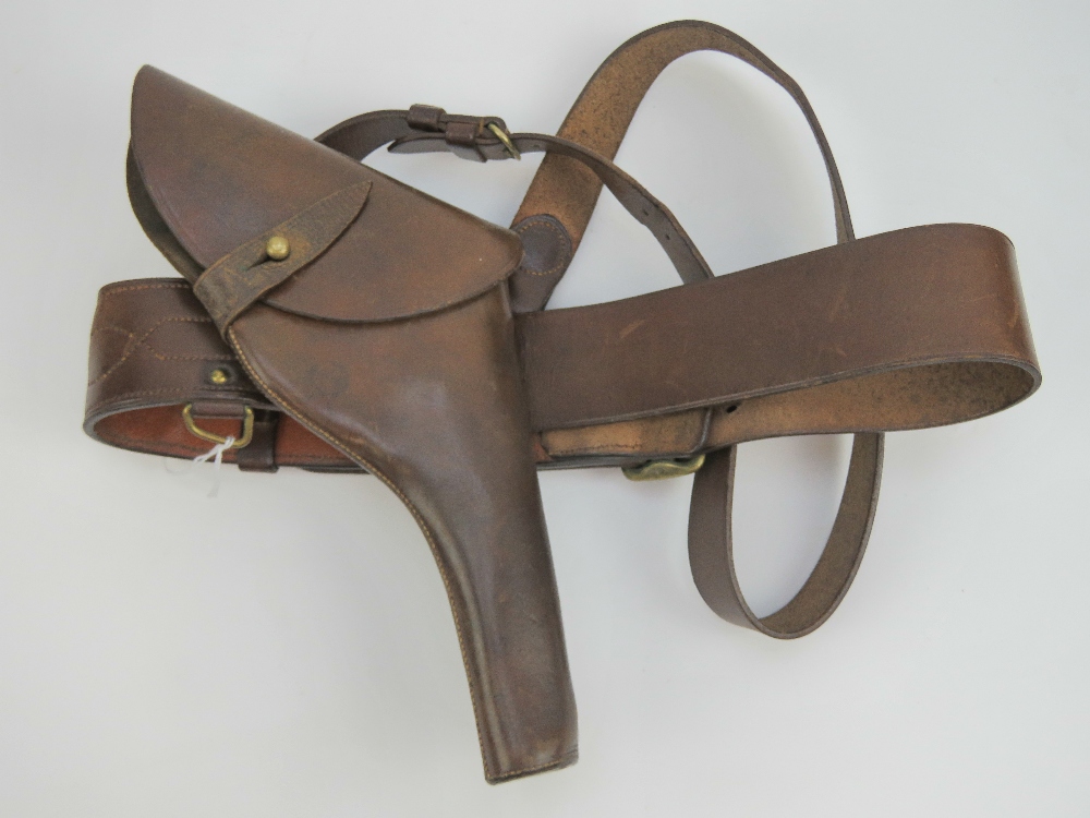 A WWI British Military Officers Sam Browne leather belt with shoulder strap and brass fittings,