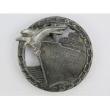 A WWII German Kriegsmarine Blockade Breaker badge with Berlin makers details to back.