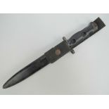 A British Military issue L1A1 SLR rifle bayonet in scabbard complete with canvas hanger,