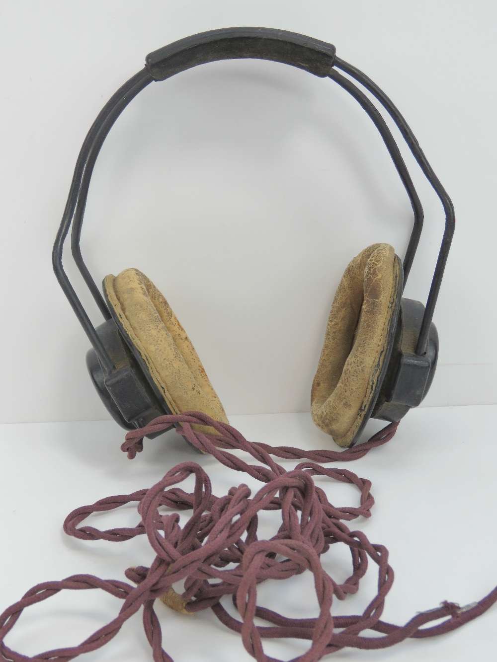 A WWII headset from a Lancaster, having Air Ministry marks upon.