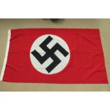 An WWII German flag measuring 100 x 170cm, having makers label upon.