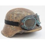 A reproduction WWII German SS Dispatch Riders helmet with worn decal, liner and chipstrap,