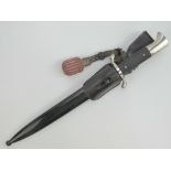 A WWII German Fire Service bayonet with leather frog and leather and silver thread portapee knot.