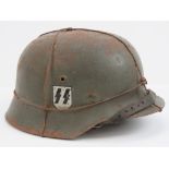 A reproduction WWII German SS helmet with wire and single decal having liner and chin strap,