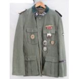 A reproduction SS Das Reich Officers tunic with reproduction medals and Italian Campaign ribbons