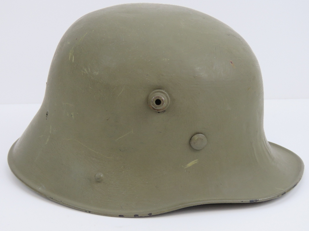 A WWI Austrian / German M16 Infantry issue helmet, repainted,