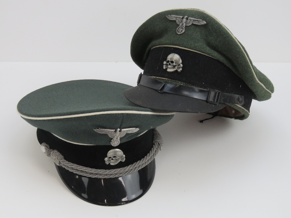 Two film/TV prop WWII German SS officers peaked caps, one leather peak one plastic peak.