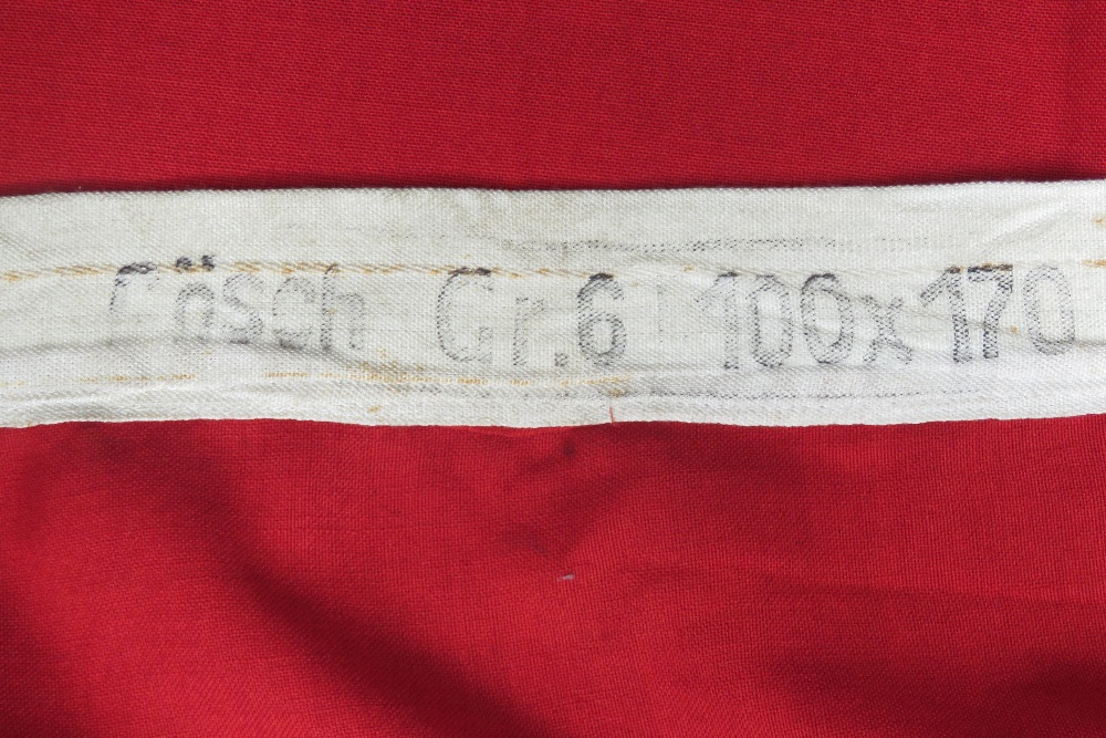 An WWII German flag measuring 100 x 170cm, having makers label upon. - Image 3 of 3