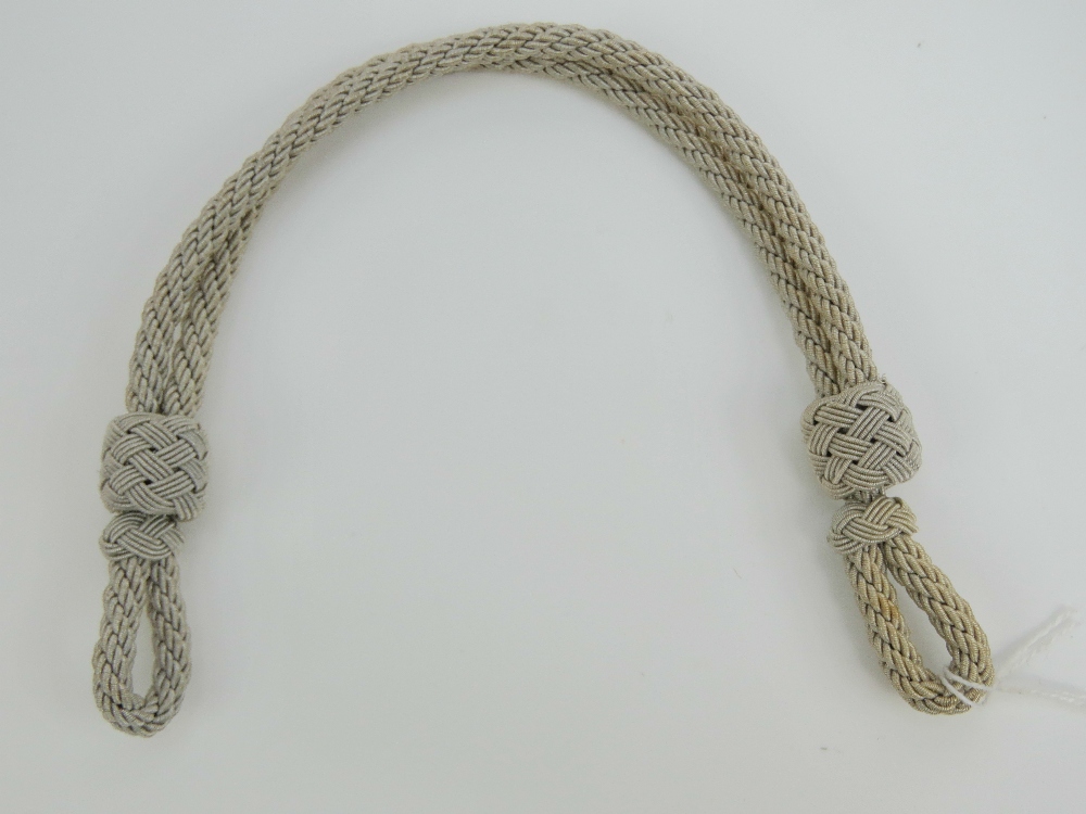 A WWII German Army peak cap cord measuri