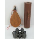 A vintage leather case measuring 32cm in length together with a leather flask and a pair of