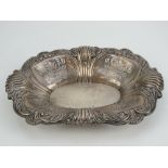 A HM silver oval shaped fruit bowl having shell pattern and pierced decoration throughout,