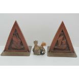 A pair of Oriental carved wooden and engraved brass bookends, each standing 18cm high,
