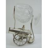 A brandy warmer in the form of a cannon complete with glass, measuring 15cm in length.