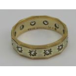 A 9ct gold eternity ring set with white stones in white and yellow metal hallmarked 375. 3.