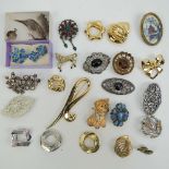 A quantity of assorted 20th century brooches and scarf clips including a dog brooch marked Carven