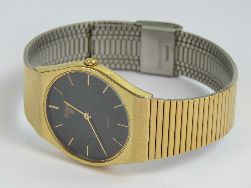 A Pulsar Quartz gold plated wristwatch having circular black ground face, - Image 4 of 4