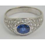 An 18ct white gold Ceylon blue sapphire and diamond ring, central oval cut sapphire approx 1.