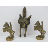 A brass door knocker in the form of a fox together with a pair of brass figurines of horses.