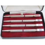 A delightful set of four silver 'Bridge' pencils each having a playing cards suit to terminal,