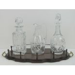 A Brierley three piece heavy lead crystal decanter set comprising matching square shaped and mallet
