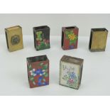 Three cloisonné brass matchbox covers together with a brass and enamel matchbox cover and two