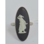 A HM silver ring having inset marquise shaped black Jasperware panel by Wedgwood, size R.