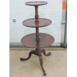 A three-tier late Georgian mahogany whatnot having graduating levels measuring 36,