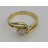 A 14ct gold solitaire white stone ring, stamped 585, size N, 2.7g.