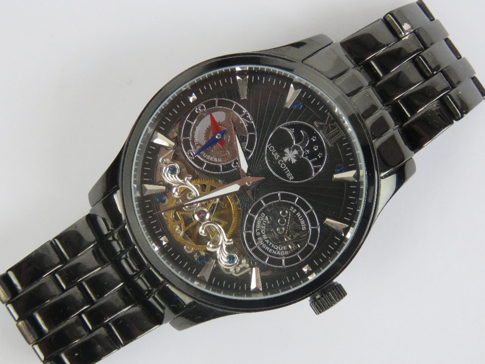 A Louise Cottier automatic Dual Time 'Phantom' wristwatch in black stainless steel having skeleton