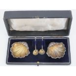 A pair of HM silver salts in the form of shells hallmarked Birmingham 1900 and complete with