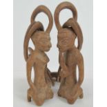 A 20th century carved wood African marriage symbol comprising male and female forms united by